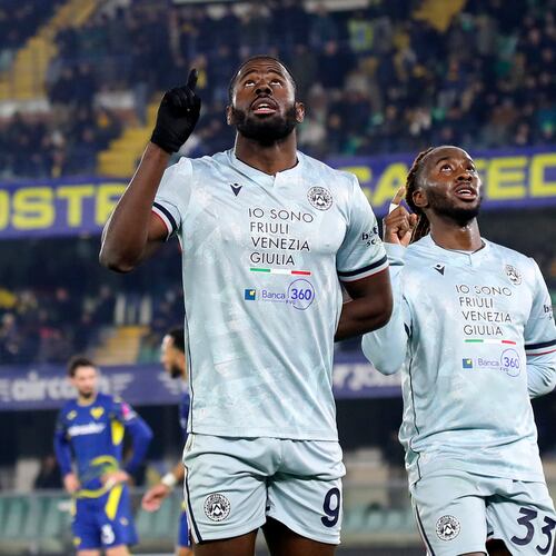 Udinese's Keinan Davis, left, celebrates after scoring their third goal during the Serie A soccer match between Hellas Verona and Udinese in Verona, Italy, Monday Jan. 26, 2026. (Paola Garbuio/LaPresse via AP)