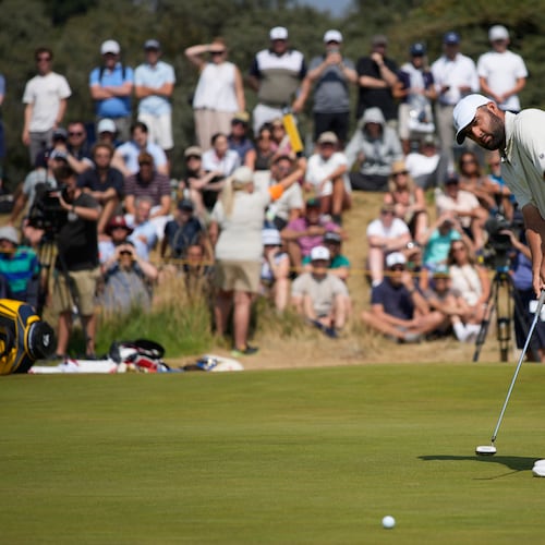 Scottie Scheffler of the United States putts on the 1st green during the second day of the British Open Golf championships at Royal Birkdale golf club, in Southport, England, Friday, July 17, 2026. (AP Photo/David Goldman)