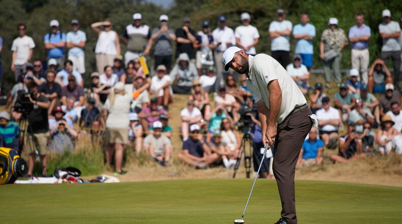 Scottie Scheffler of the United States putts on the 1st green during the second day of the British Open Golf championships at Royal Birkdale golf club, in Southport, England, Friday, July 17, 2026. (AP Photo/David Goldman)