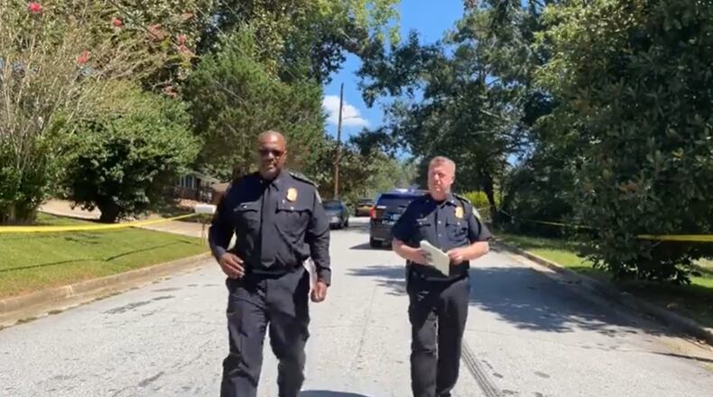 Atlanta police Deputy Chief Charles Hampton (left) and Chief Darin Schierbaum speak at the scene of a deadly shooting in northwest Atlanta on Sunday.