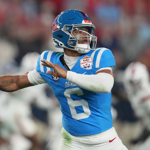 Mississippi quarterback Trinidad Chambliss throws during the first half of the Fiesta Bowl NCAA college football playoff semifinal game against Miami, Thursday, Jan. 8, 2026, in Glendale, Ariz. (AP Photo/Rick Scuteri)