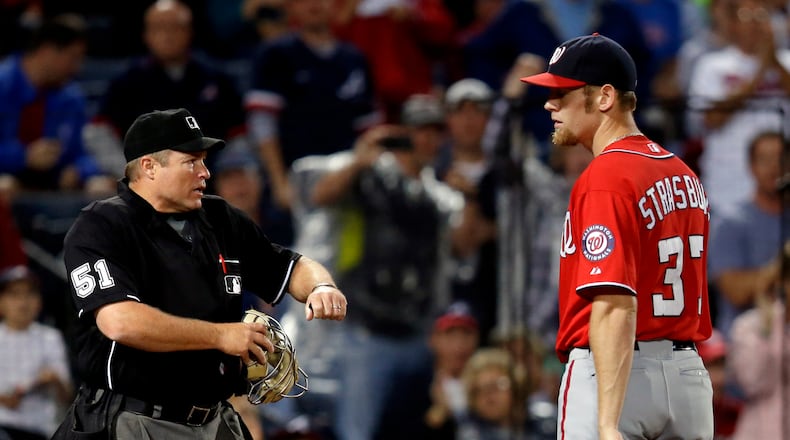 Nationals pitcher Stephen Strasburg was ejected by umpire Marvin Hudson for throwing consecutive pitches behind the Braves' Andrelton Simmons.