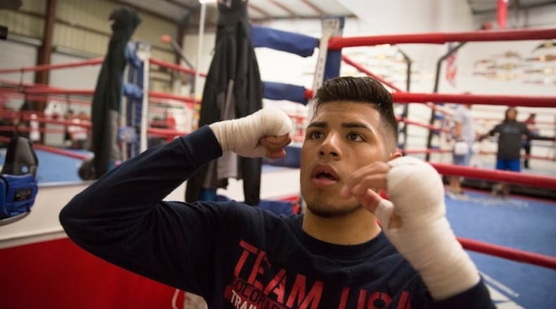 U.S. Olympic boxing team member Carlos Balderas hits a bag at his hometown gym in Santa Maria, Calif., on May 19, 2016. (Brian van der Brug/Los Angeles Times/TNS)