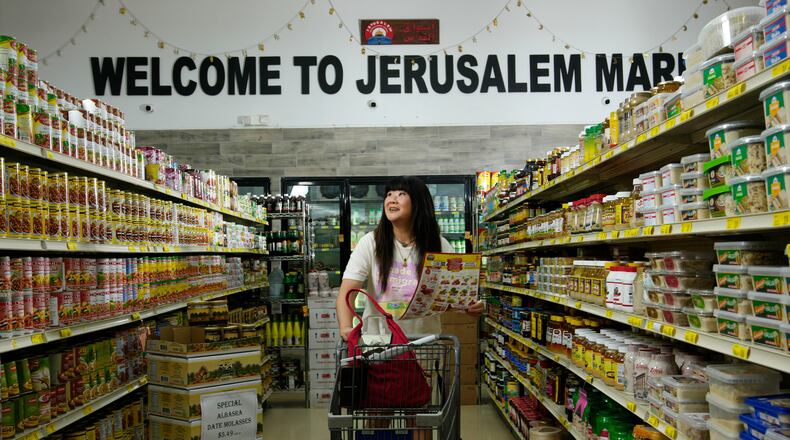 Jenny Yang walks through the Jerusalem Market prior to The Good Egg Immigrant Grocery Store Stand Up Comedy Tour show, July 31, 2026, in Phoenix. (AP Photo/Ross D. Franklin)
