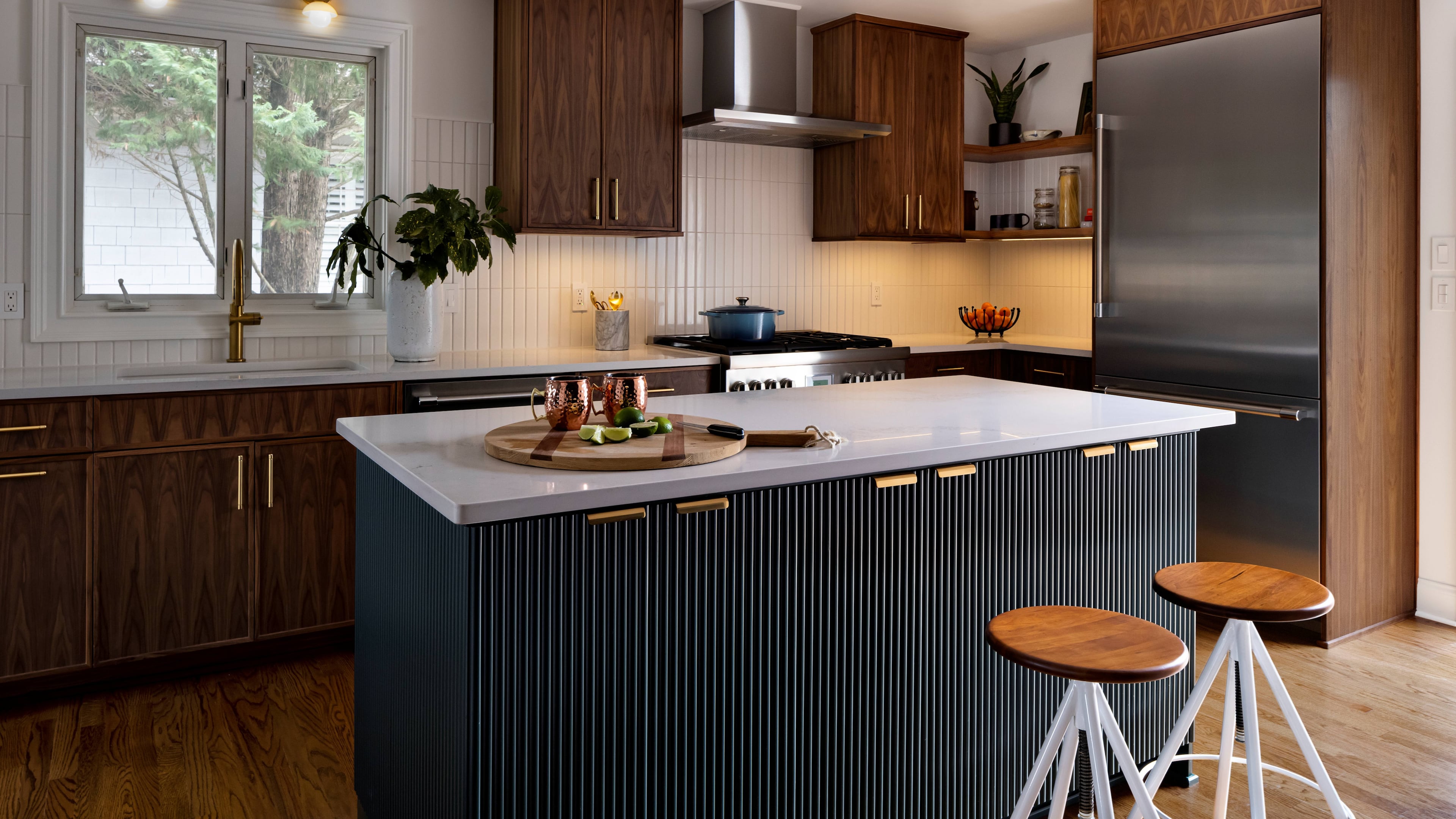 Professional design elements such as open bowl utility sinks, hood systems and industrial faucets are part of a trend in home remodeling. (Courtesy of Rook & Dash Design, Allerdice Construction/Raftermen Photography)