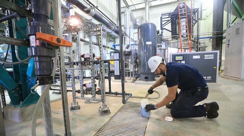 Operator Timothy Donovan takes effluent samples twice daily inside the nutrient recovery building at the F. Wayne Hill Water Resources Center on Monday, Oct. 12, 2015, in Buford. Gwinnett has installed a system that mines phosphorus from wastewater and makes pellets that can be sold as fertilizer. Curtis Compton / ccompton@ajc.com