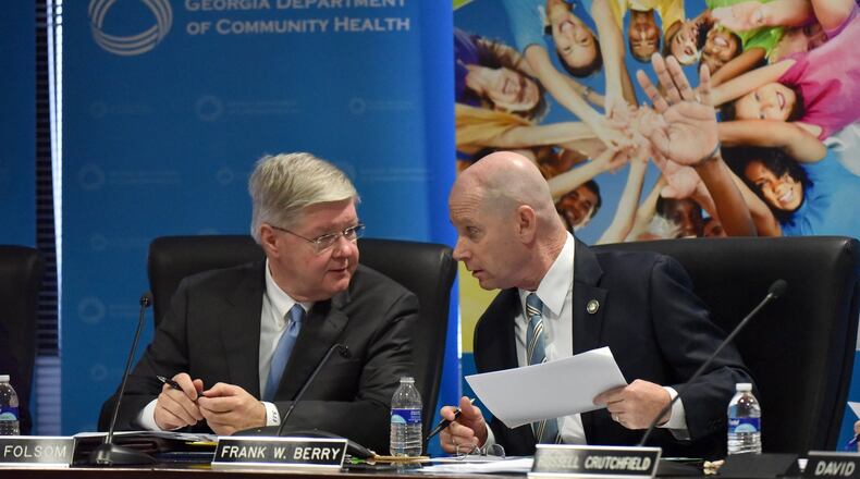 Roger Folsom (left), vice chairman, and Frank W. Berry, commissioner of the Georgia Department of Community Health (DCH), confer during a Georgia Department of Community Health board meeting in Atlanta in August.  At that point Georgia had failed to perform targeted infection control inspections of hospitals that were requested by the federal government as a result of the pandemic.  (PHOTO by Hyosub Shin / Hyosub.Shin@ajc.com)