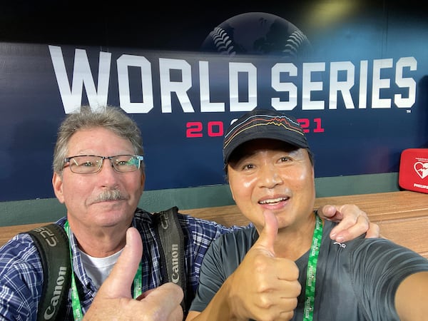 Hyosub Shin and retired AJC photographer Curtis Compton at the 2021 World Series.