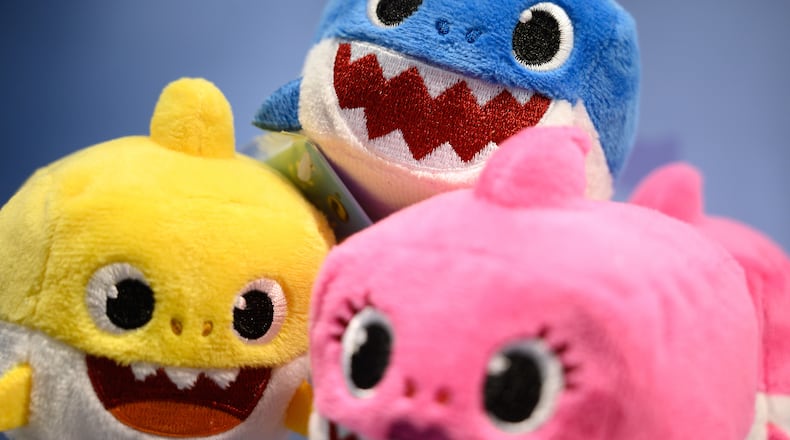 A selection of "Baby Shark" toys are seen on a display at the annual "Toy Fair" at Olympia London on January 22, 2019 in London, England. A California dad says he taught his 2-year-old daughter to do chest compressions, and says "Baby Shark" can be a great teaching tool.