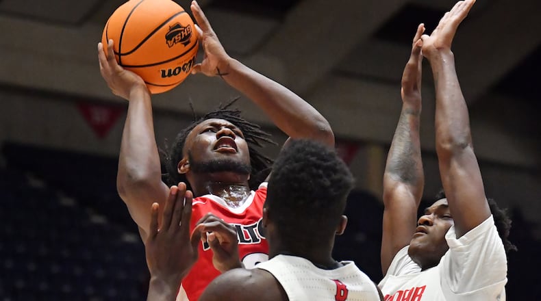 March 13, 2021 Macon - Milton's Bruce Thornton (2) gets off a shot between Berkmar's Dara Olonade (12) and Berkmar's Jermahri Hill (right) during the 2021 GHSA State Basketball Class AAAAAAA Boys Championship game at the Macon Centreplex in Macon on Saturday, March 13, 2021 Milton won 52-47 over Berkmar. (Hyosub Shin / Hyosub.Shin@ajc.com)