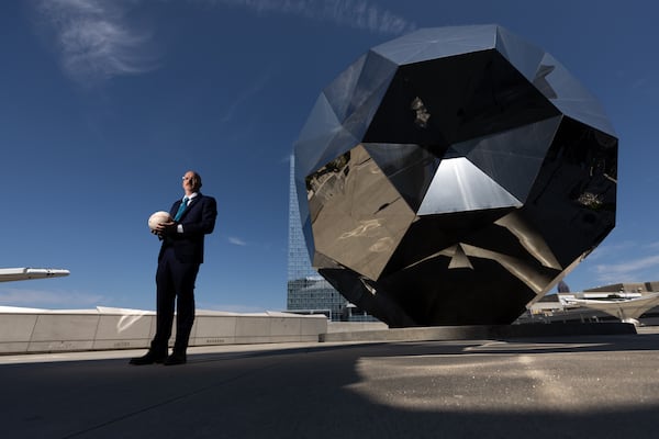 Michael Collins, former Color Of Change director, poses for a portrait at the soccer ball sculpture at Mercedes-Benz Stadium in Atlanta on Tuesday, September 9, 2025. He’s leading a new coalition to hold Atlanta accountable on human rights ahead of the 2026 World Cup. (Arvin Temkar/AJC)