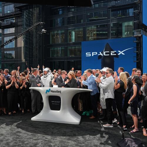 SpaceX employees celebrate during a closing bell ceremony for the IPO of SpaceX at the Nasdaq MarketSite in New York, Friday, June 12, 2026, in New York. (AP Photo/Frank Franklin II)