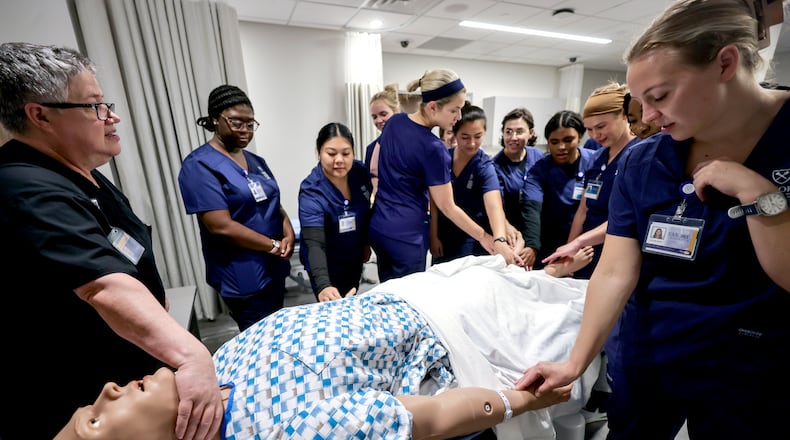 Kim Fugate, senior simulation operations specialist at the Emory Nursing Learning Center, demonstrates how to use Emory HAL to Distance-Accelerated nursing students on Wednesday, Aug. 7, 2024. (Natrice Miller/ AJC)