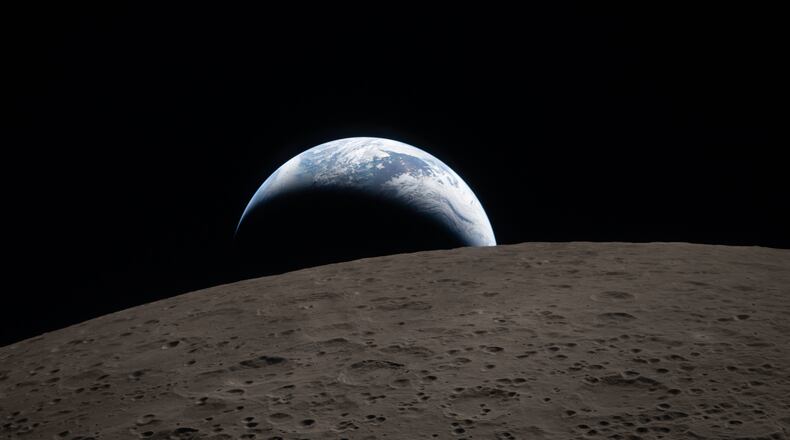 In this image provided by NASA, The Artemis II crew captured this view of an Earthset on Monday, April 6, 2026, as they flew around the Moon. (NASA via AP)
