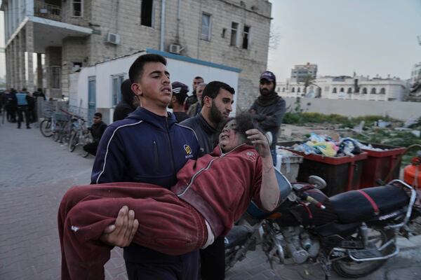 Palestinians who were injured in an Israeli airstrike, are brought for a treatment at the Baptist Hospital in Gaza City, on Thursday, April 3, 2025. (AP Photo/Jehad Alshrafi)