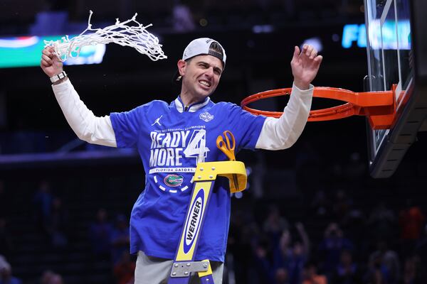Florida head coach Todd Golden celebrates after cutting down the net following his team's win over Texas Tech in the Elite Eight of the NCAA college basketball tournament, Saturday, March 29, 2025, in San Francisco. (Scott Strazzante/San Francisco Chronicle via AP)