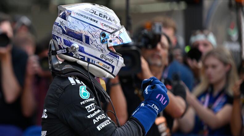 Mercedes driver Andrea Kimi Antonelli of Italy celebrates after setting the pole position during the qualifying session for the Monaco F1 Grand Prix, at the Monaco racetrack, Saturday, June 6, 2026. (AP Photo/Philippe Magoni)