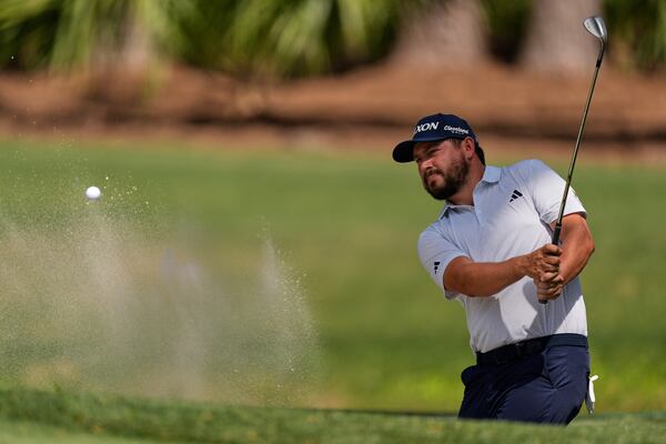 Andrew Novak hits from the bunker on the seventh hole during the final round of the RBC Heritage golf tournament, Sunday, April 20, 2025, in Hilton Head Island, S.C. (AP Photo/Mike Stewart)