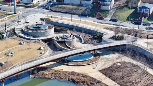 A drone image shows the stormwater retention pond at Rodney Cook Sr. Park in Vine City on Monday, Feb 9, 2026. The park officially opened to the public on June 29, 2021. The park was designed to address chronic neighborhood flooding. (Miguel Martinez/AJC)