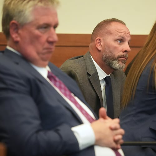 FILE - Jason Meade, center, sits with his attorneys Mark Collins, left, and Kaitlyn Stephens, right, during opening statements in the retrial of the former Ohio sheriff's deputy charged with murder and reckless homicide in the 2020 killing of Casey Goodson Jr., inside Franklin County Common Pleas Court in Columbus, Ohio, April 23, 2026. (Doral Chenoweth/Pool photo via AP, File)