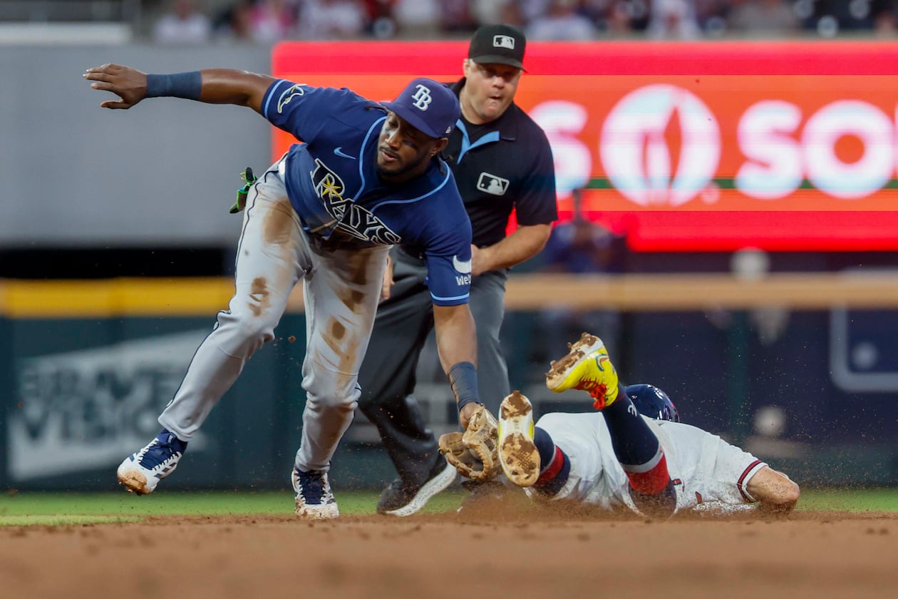 Atlanta Braves left fielder Mauricio Dubón (14) is tagged out by Tampa Bay Rays shortstop Jorge Mateo (9) in the first inning at Truist Park on Wednesday, Sep. 9, 2026, in Atlanta. (Miguel Martinez/ AJC)