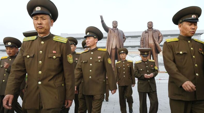 North Korean military personnel visit Mansu Hill in Pyongyang to lay flowers at the bronze statues of the country's two late leaders, Kim Il Sung and Kim Jong Il, on the 85th anniversary of the founding of its armed forces.