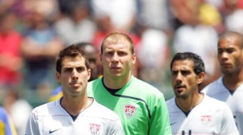 The friendship between Carlos Bocanegra (front) and Brad Guzan (in green) goes back to their days as teammates on the U.S. national team. (Getty)