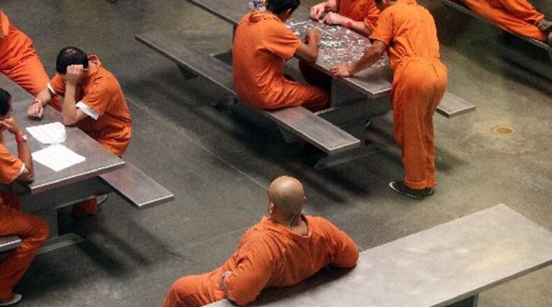 Detainees at the Irwin County Detention Center in Ocilla, putting together a puzzle on Thursday, April 19, 2012. Curtis Compton ccompton@ajc.com