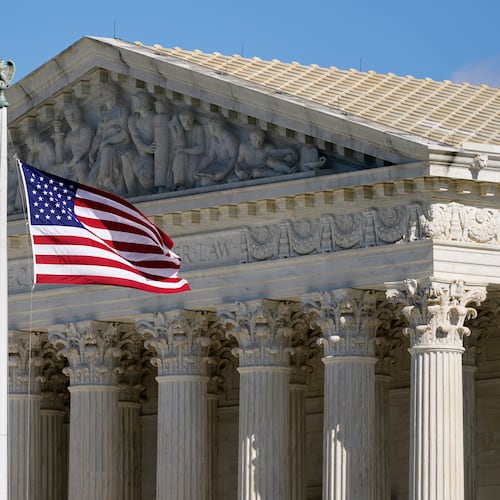 FILE - An American flag waves in front of the Supreme Court building on Capitol Hill in Washington, on Nov. 2, 2020. (AP Photo/Patrick Semansky, File)