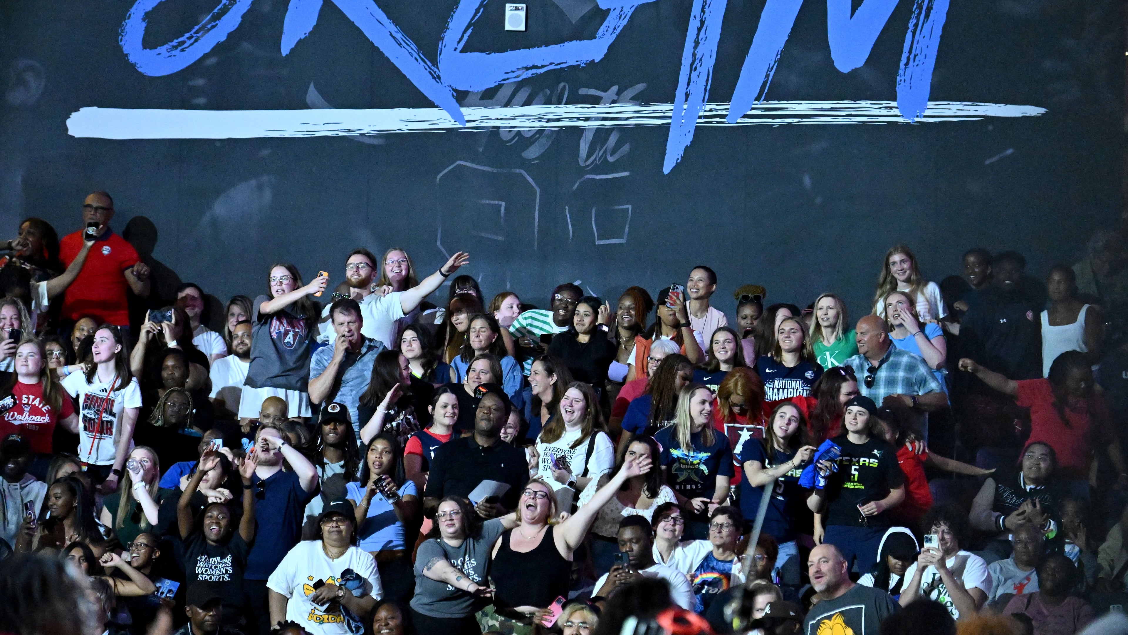 Atlanta Dream fans cheer during the second half in a WNBA basketball game at Gateway Center Arena, Saturday, May 24, 2025, in Atlanta. Atlanta Dream won 83-75 over Dallas Wings. (Hyosub Shin / AJC)