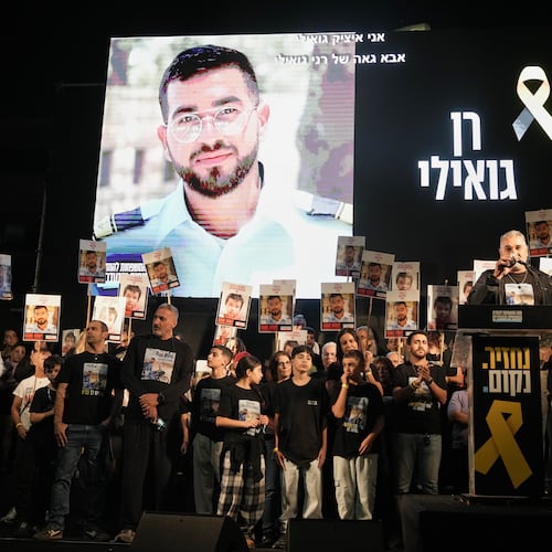 FILE - A photo of slain hostage Ran Gvili, whose remains are being held by Hamas in the Gaza Strip, is displayed during a rally calling for the return of the deceased hostages held in Gaza, in Tel Aviv, Israel, on Nov. 29, 2025. (AP Photo/Mahmoud Illean, File)