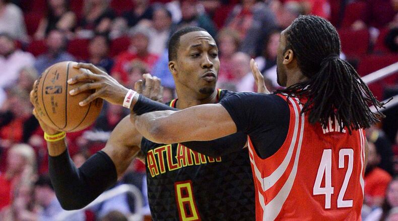 Atlanta Hawks center Dwight Howard (8) pulls the ball away from Houston Rockets center Nene (42) during the second half of an NBA basketball game Thursday, Feb. 2, 2017, in Houston. (AP Photo/George Bridges)