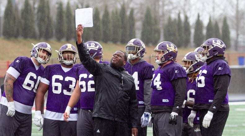 Offensive assistant coach Miles Roberson shows the offense the plays during the Atlanta Legends practice  at Milton High School in Milton Friday 22, 2018, the same day Rich Bartel resigned as quarterbacks coach.  STEVE SCHAEFER / SPECIAL TO THE AJC