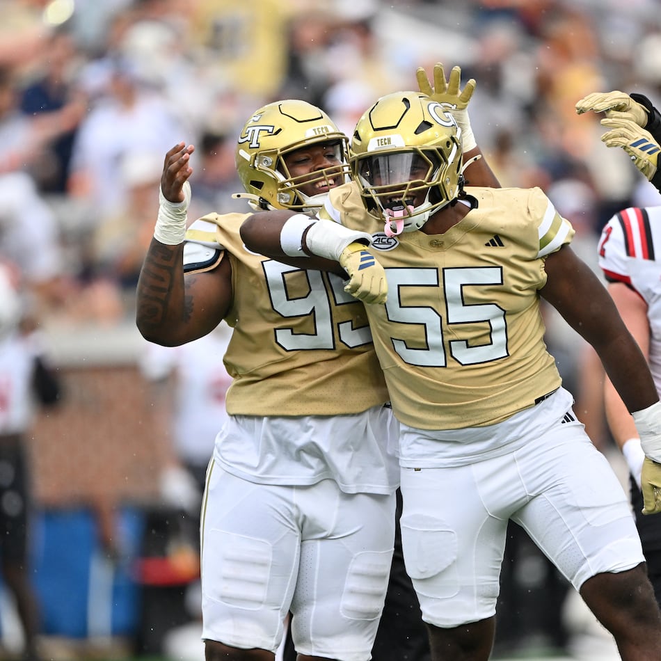 Georgia Tech defensive linemen Christian Garrett (55) and Jason Moore (95) react during the first half of an NCAA college football game at Georgia Tech's Bobby Dodd Stadium, Saturday, November 6, 2025 in Atlanta. (Hyosub Shin/AJC)