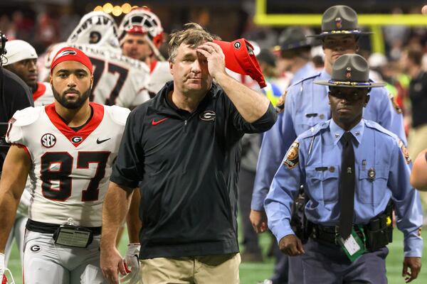 Georgia Bulldogs head coach Kirby Smart walks from the field after Alabama defeated Georgia 27-24 to bring a 29-game winning streak to a halt following the SEC Championship football game at the Mercedes-Benz Stadium in Atlanta, on Saturday, December 2, 2023.  (Jason Getz / Jason.Getz@ajc.com)