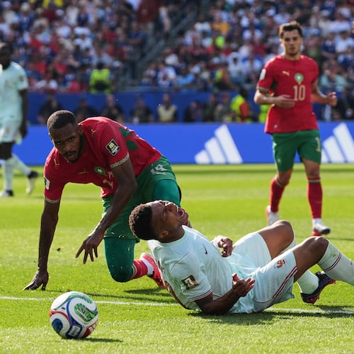 France's Kylian Mbappe (10) reacts to being tripped by Morocco's Issa Diop, left, during the World Cup quarterfinal soccer match between France and Morocco in Foxborough, Mass., near Boston, Thursday, July 9, 2026. (AP Photo/Stephanie Scarbrough)