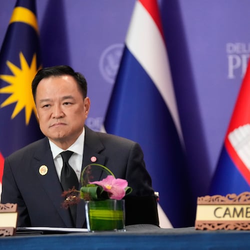 FILE - Cambodian Prime Minister Hun Manet, right, and Thailand's Prime Minister Anutin Charnvirakul, left, react during a signing ceremony on the sidelines of the ASEAN Summit in Kuala Lumpur, Malaysia, Sunday, Oct. 26, 2025. (AP Photo/Mark Schiefelbein, File)