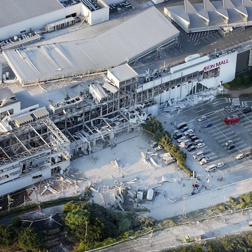 This aerial image shows the damaged AEON Mall following an earthquake in Kashima, Kumamoto prefecture, southern Japan, Tuesday, July 28, 2026. (Kyodo News via AP)