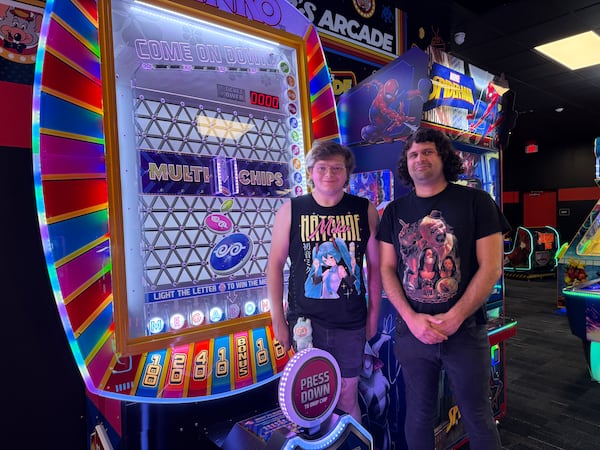 Athens' Spencer Brose, 24 (left), and Chris Epps, 35, visited the Chuck's Arcade in Buford on July 12, 2025, to relive their childhood memories of arcade games. They had heard about the new adultcentric arcade on TikTok. (Danielle Charbonneau/AJC)