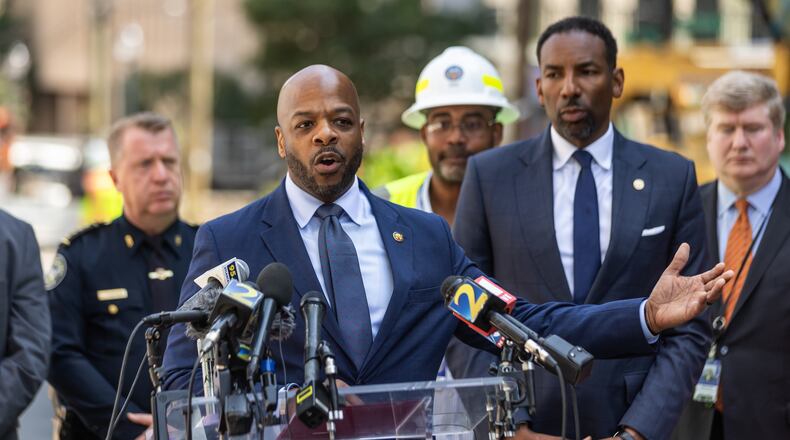 Watershed Commissioner Al Wiggins speaks at a press conference on June 3, 2024, alongside Atlanta Mayor Andre Dickens, shortly after the city got a geyser in Midtown under control. It took days for crews to slow the flow of water through the broken pipeline because shut-off valves that had been neglected in the area failed, delaying repairs and forcing thousands of residents to boil their water for nearly a week. (John Spink/AJC)