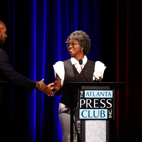 Democratic candidates for Congress, Everton Blair, left, and Jasmine Clark shake hands after the Atlanta Press Club Loudermilk-Young District 13 primary election debate at Georgia Public Broadcasting, Monday, April 27, 2026, in Atlanta. (Arvin Temkar/Atlanta Journal-Constitution via AP)