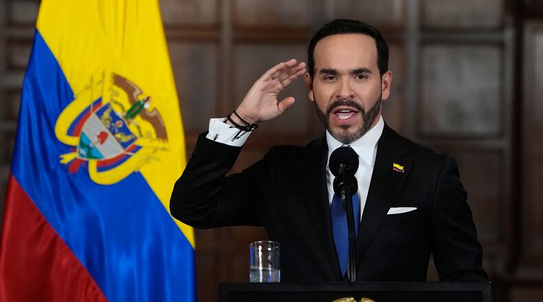 Colombia's President Abelardo De la Espriella announces a joint effort with Bogota's Mayor Carlos Fernando Galan to strengthen security in the Colombian capital through increased police presence, intelligence, technology, and urban capabilities in Bogota, Tuesday, Aug. 25, 2026. (AP Photo/Fernando Vergara)