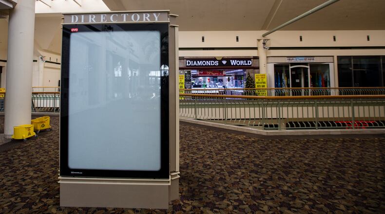 Gwinnett Place Mall is nearly empty of stores and shoppers with many entrances locked Wednesday, Dec 23, 2020. The mall is being purchased by Gwinnett County, and is working on redevelopment plans for the neglected space. (Jenni Girtman for The Atlanta Journal-Constitution)