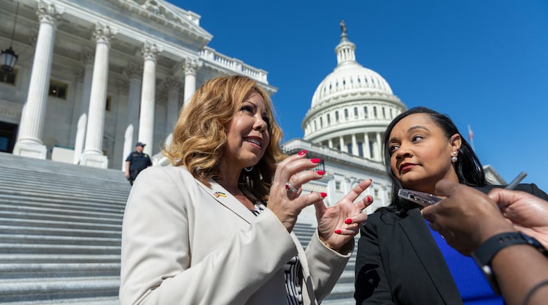 U.S. Rep. Lucy McBath, left, and U.S. Rep. Nikema Williams speak to a reporter after an event in Washington marking the one-year anniversary of the Atlanta spa shootings. McBath is a key member on the House Judiciary Committee when it discusses gun policy.