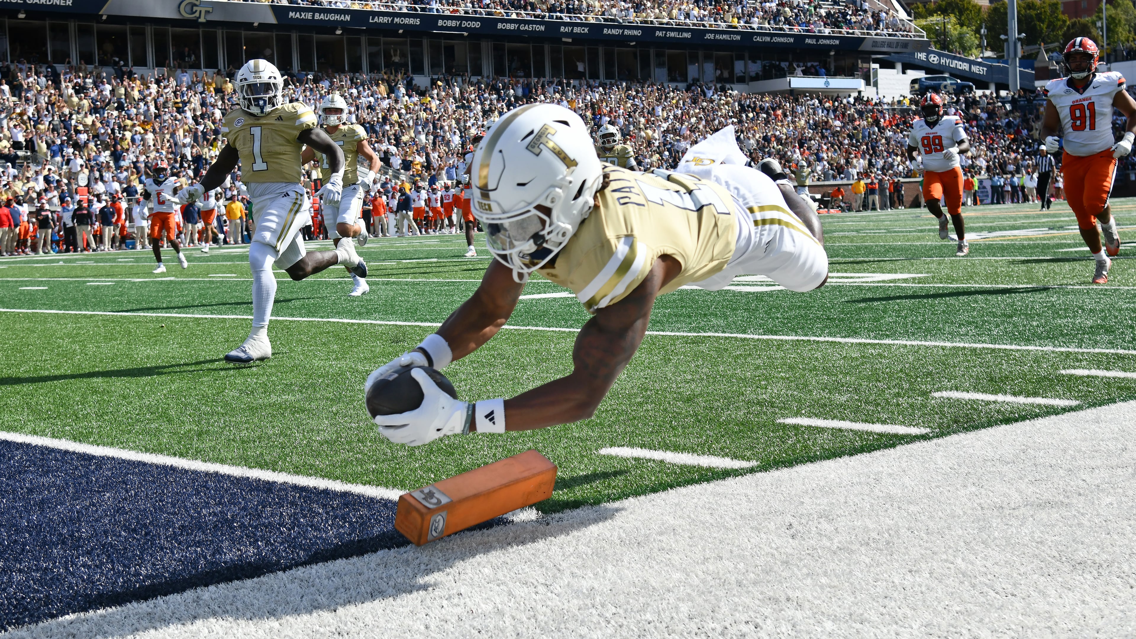 Georgia Tech wide receiver Dean Patterson dives into the end zone for a 37-yard touchdown reception off a screen pass Saturday, Oct. 25, 2025, against Syracuse in Atlanta. Patterson has just six catches this season, but two have been TDs, and he's a standout on special teams. (Hyosub Shin/AJC)
