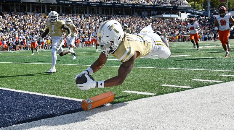 Georgia Tech wide receiver Dean Patterson dives into the end zone for a 37-yard touchdown reception off a screen pass Saturday, Oct. 25, 2025, against Syracuse in Atlanta. Patterson has just six catches this season, but two have been TDs, and he's a standout on special teams. (Hyosub Shin/AJC)