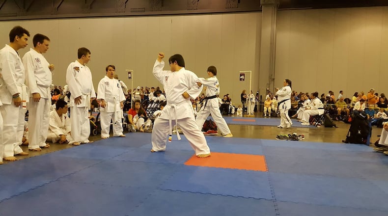 A student from Marcus McAbee’s class shows off his skills to judges during the multistate American Taekwondo Association Tournament in 2016. He won first place. CONTRIBUTED