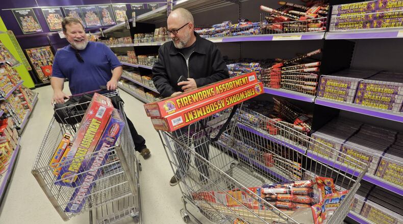 December 29, 2016 - Roswell - Karl Kroeppler (right) from Woodstock, and Paul Grupe, from Canton, pick out fireworks. Shoppers browse the aisles of Phantom Fireworks of Rowsell for New Year’s celebrations. A drought released fireworks ban was repealed. BOB ANDRES /BANDRES@AJC.COM