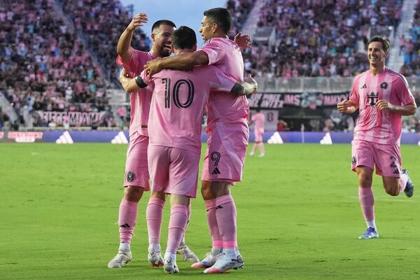 Inter Miami forward Lionel Messi (10) is congratulated after scoring a goal during the first half of an MLS soccer match against Nashville SC, Saturday, July 12, 2025, in Fort Lauderdale, Fla. (AP Photo/Lynne Sladky)