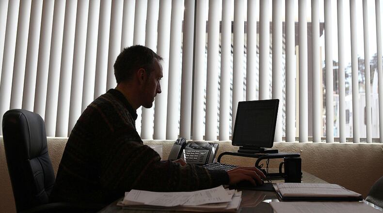SAN FRANCISCO, CA - APRIL 14: Liberty Tax Service tax preparer Ronn Seely works on tax returns on April 14, 2011 in San Francisco, California. (Photo by Justin Sullivan/Getty Images)